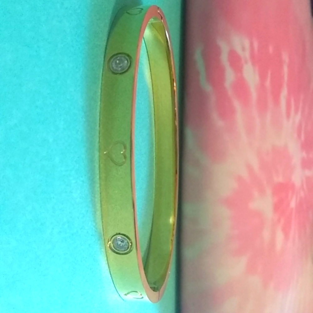 Gold bracelet with heart accent and CZ accents